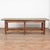 This 8' long rustic work table has a stretcher base with six legs. The base maintains it's original brown paint, while the...