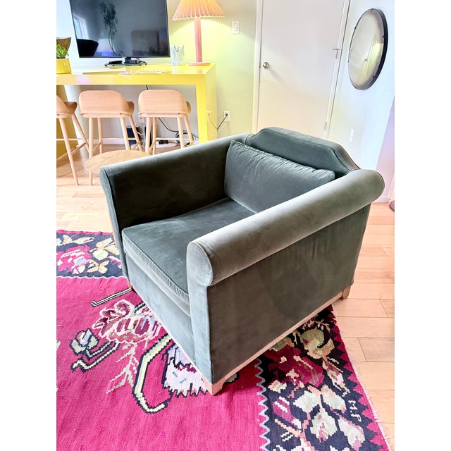 Green velvet lounge chair designed by Ross Cassidy gives a contemporary update to a traditional '60s-inspired rolled-arm...