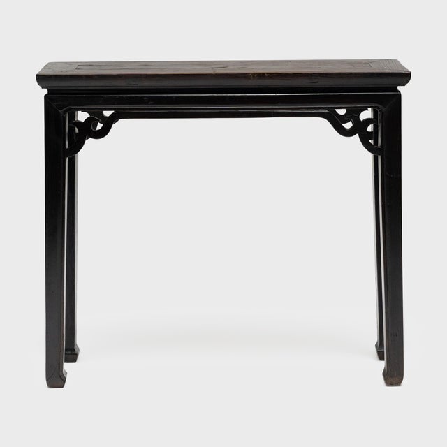 This narrow console table once resided in a 19th-century Chinese home, laden with food offerings and incense as a home...