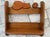 Vintage hand crafted wooden wall shelf featuring a decorative cutout of a sleeping cat and a ball of yarn along the top...