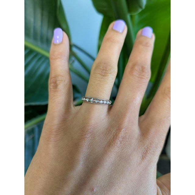Nine earth-mined diamonds sparkle across this beautifully crafted, minimalist solid 14K white gold band. Clean and modern,...