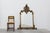 An impressive Belgian mirror in the Rococo style, featuring a richly carved resin frame with a gilt finish. The design is...