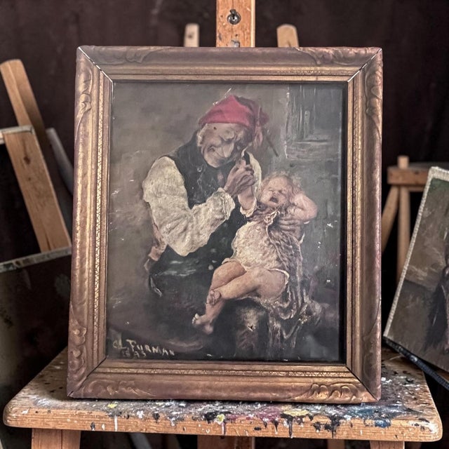 A charming late 19th-century genre oil painting depicting an elderly woman playfully startling a crying child. Signed C....