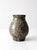 A vintage handmade studio pottery vase with a rounded baluster form and a richly variegated glaze in earthy tones of rust,...