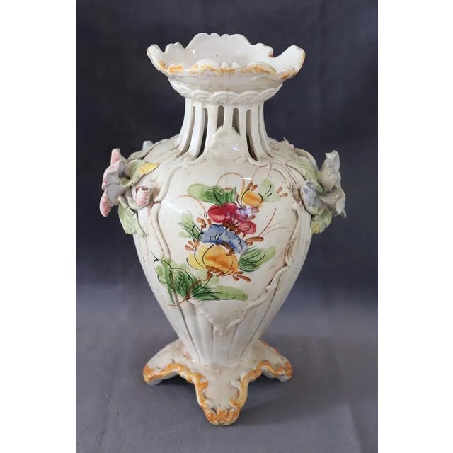 Italian hand painted ceramic vase, circa 1990s. Characterized by a classic line with floral decorations. Italian...