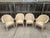 A striking and rare set of four vintage barrel-back armchairs, attributed to celebrated Filipino designer Antonio "Budji"...