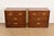 A gorgeous pair of Mid-Century Modern Campaign style nightstands or bachelor chests In the manner of Henredon By Dixie...