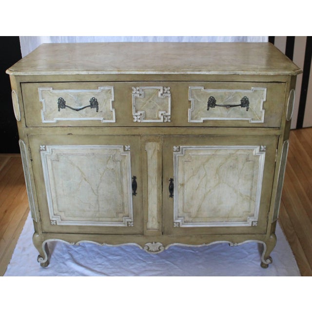 Beautifully painted faux marble carved wood cabinet in the French manner wonderful patina single drawer atop two doors.