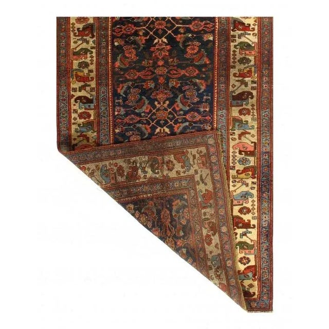 Here is a regal antique Persian rug of Bidjar design that truly represents an impressive achievement in rug making. This...