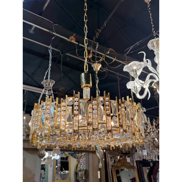 Fine quality German gilt brass and crystal chandelier. German gilt‑brass chandeliers—especially those produced in the...