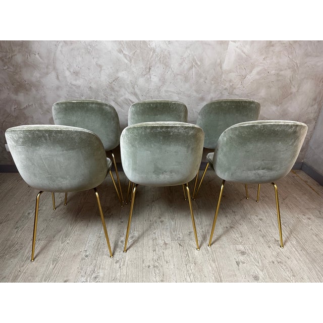 An elegant set of six Beetle chairs by the Danish company Gubi, emblematic of contemporary design with soft, organic...