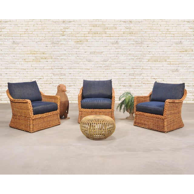 A handsome set of three late 20th century woven wicker and rattan organic modern lounge armchairs attributed to Bielecky...