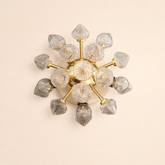 A Pair of Mid-Century Modern Sputnik Wall or Ceiling Lights This striking pair of lighting fixtures embodies the iconic...