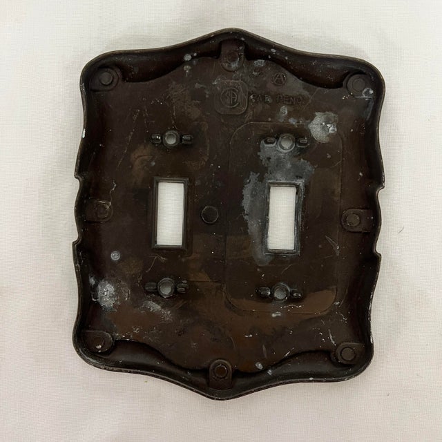 Mid century antique brass double switch plate cover. Measures 4.75” x 5.75”. Other matching pieces available in our...