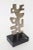 This vintage modernist cubist style steel metal sculpture sits on a black veined marble base that is original. It is...