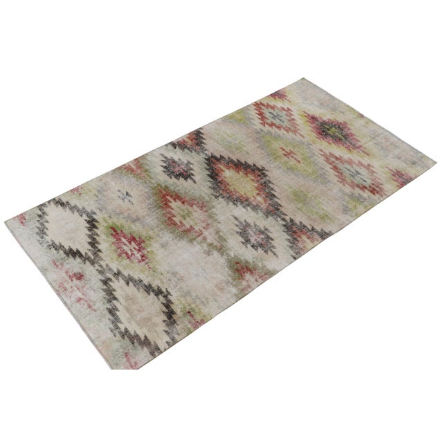 Hand-knotted in wool, a 5x9 vintage rug from a bold Turkish atelier, entering Rug & Kilim’s commemorative Mid-Century...