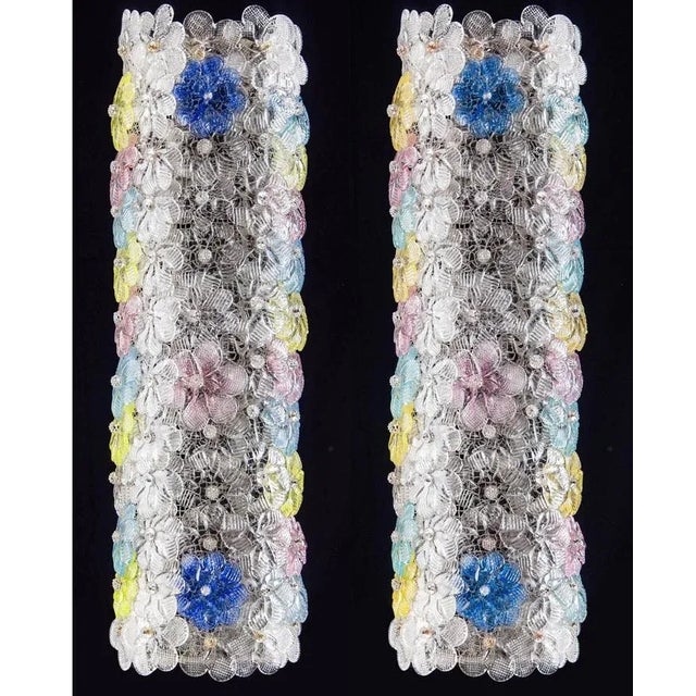 Unusual and rare pair of wall sconces. Each sconce contains dozen of colored Venetian glass flowers. Up to 250V (Europe/UK...