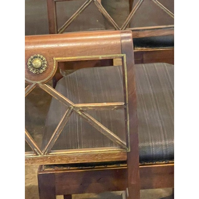 This set of Northern European walnut and brass dining chairs is a luxurious and stylish addition to any home. The chairs...