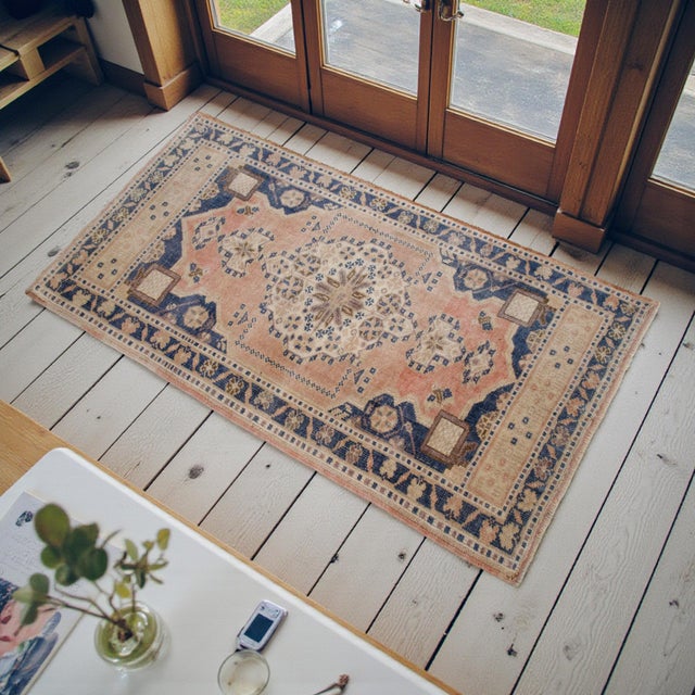 Elevate your home decor with this exquisite vintage Oushak rug, a true testament to authentic Anatolian craftsmanship....