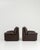 A stylish pair of Italian armchairs reflecting 1970s design sensibilities, combining comfort with sculptural form. The...