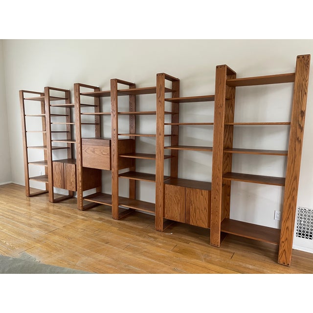 1970s California Modern Modular Oak Bookcase / Display Unit, Attributed to Lou Hodges This spectacular 204” wide unit is...