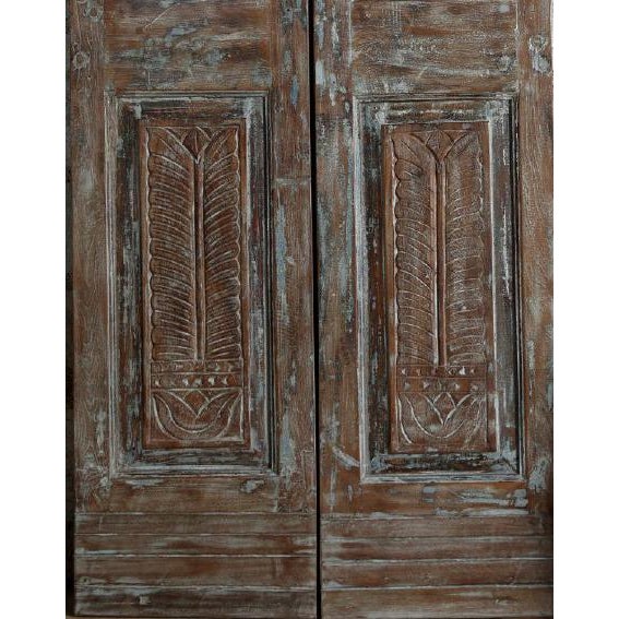 Add old-world character and artisan craftsmanship to your home with these vintage hand-carved wood double doors finished...