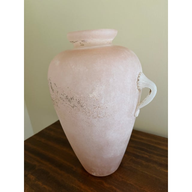 A beautiful Roman style pink Scavo glass vase. Scavo glass was created in the mid-20th century by using a technique...