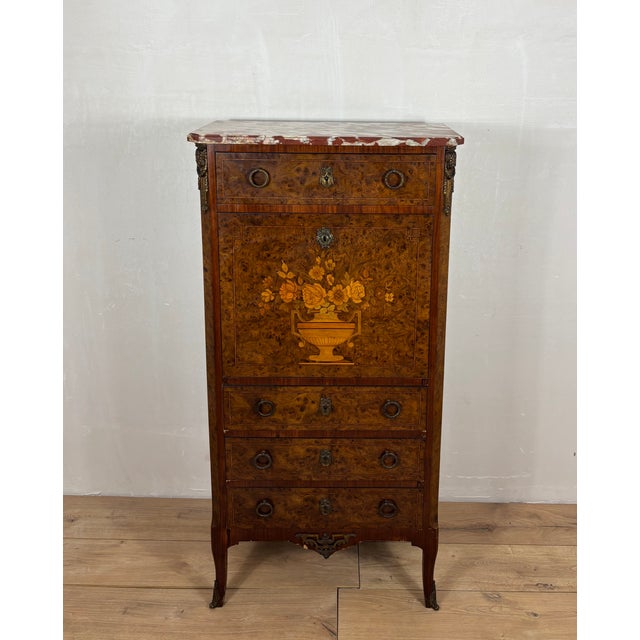 Elegant French secretary chest in Louis XVI style, beautifully crafted with richly figured wood veneer and fine floral...