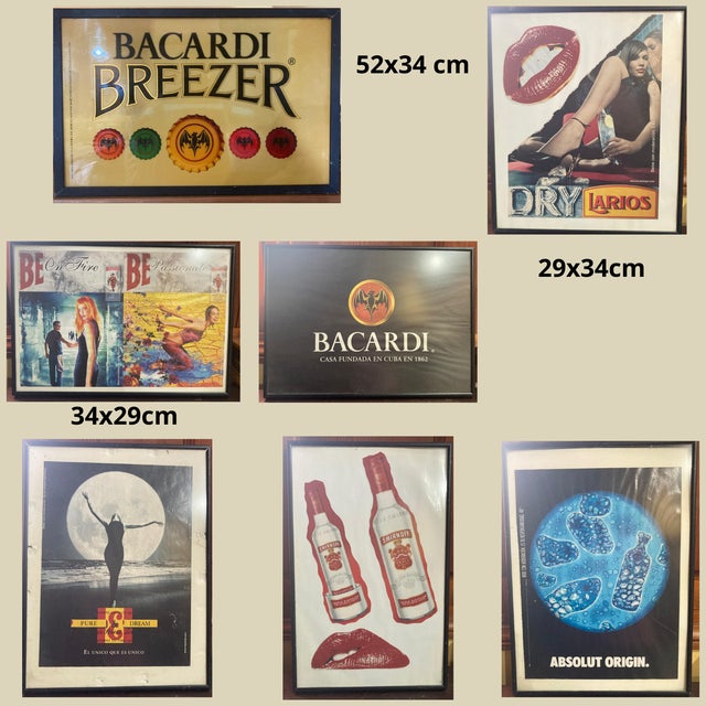 Set of 7 Bakelite framed advertisements. 1990s. Brands: Larios, Bacardi, J&B, Smirnoff, Absolut, and Beefeater....