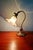 Art Nouveau desk lamp in bronze and opalescent glass with a glass shade, early 20th century. The lamp is articulated at...