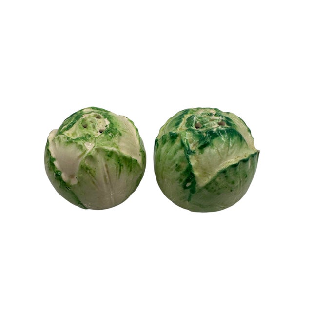 Set of green cabbage shaped salt & pepper shakers. Made in Japan. Each have 2 holes. Plastic stoppers not included.