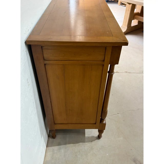 This beautiful 19th century French Louis XVI sideboard made of exotic mahogany wood has been finished with a lustrous...