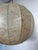 This is a Goldkant Leuchten Cocoon Pendant light from Germany circa 1970. There are dark maroon colored fibers throughout...