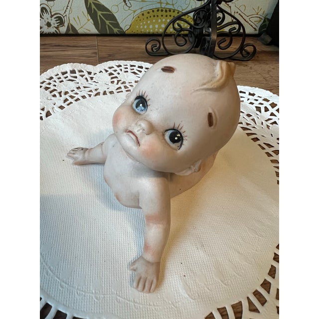 Up for consideration is a beautiful vintage ceramic Kewpie baby figurine. This piece would look lovely in a nursery for a...