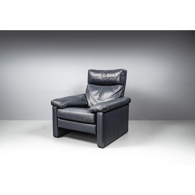 Leather Armchair by COR, Conseta Made in Germany 1980s It is covered with thick blue leather, has quality upholstery and...