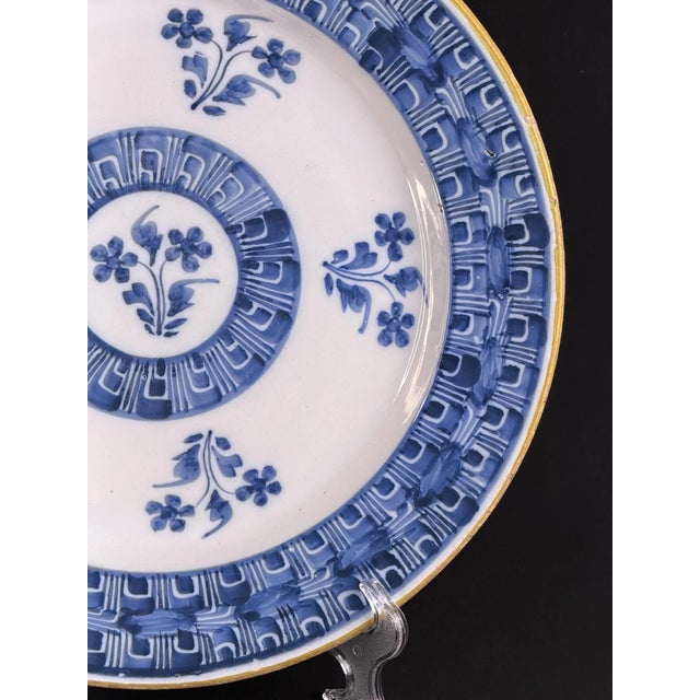 Beautiful late-18th / early-19th century Delft faience wall plate, richly hand-painted in cobalt blue. The geometric...