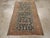 This early 20th century Persian Malayer rug, measuring 3' 3" x 5' 7", showcases a dynamic interplay of color and form...