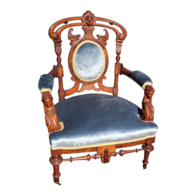 Beautiful 19th-century American walnut Eastlake parlor chair featuring exceptional caryatid figural arm supports, fine...