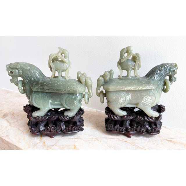 This is a regal pair of Antique Chinese Dragon Jade Vessels with their Custom Rosewood Stands, circa 1920, Qing / Republic...
