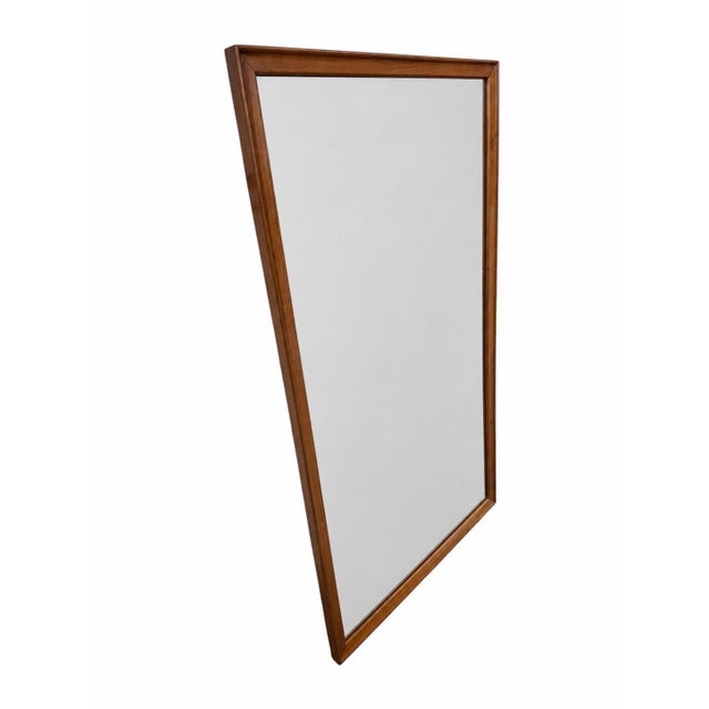 Enhance your home with this authentic Mid-Century Modern Drexel walnut wall mirror, a timeless piece that showcases the...