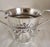A remarkable Queen Anne period Britannia standard silver porringer, dating to the early 18th century and richly decorated...
