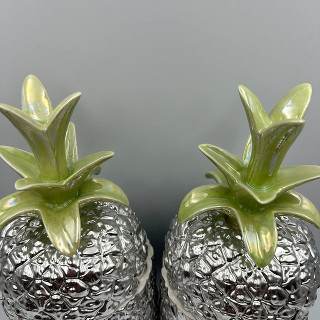 Pair of large Italian hand made ceramic pineapple pottery jars / canisters, each measuring approximately 13 1/2" tall. The...
