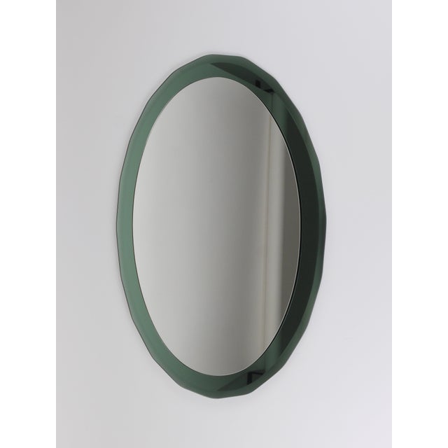 A distinctive mirror double-level wall mirror from the 1960s, made in Italy by Cristal Arte / Crystal Art. The mirror can...