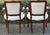 Beautiful matching pair of Louis XV-style fauteuil armchairs with dark wood frames. The chairs feature elegant carved...