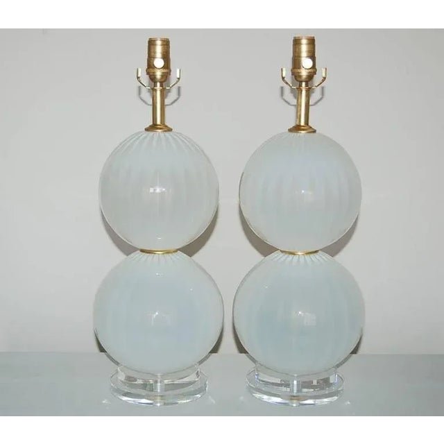 Found lounging in the back of our warehouse, this great pair of Joe Cariati handblown glass lamps in OYSTER WHITE. The...