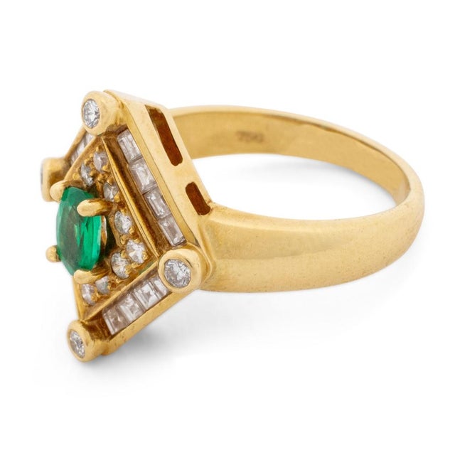 18K Yellow Gold Emerald Diamond Ring, featuring one prong set oval brilliant emerald weighing approx. 0.30 carat, further...