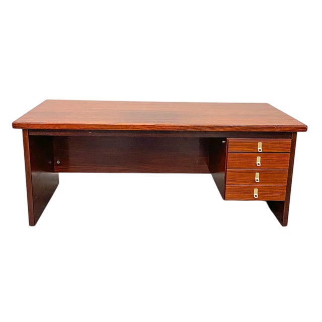 A finely constructed and functional Danish modern rosewood executive desk. The desk is imposing and yet quite useable and...