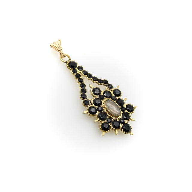 This impeccably crafted 14k gold mourning pendant dates to the 1820’s and is completely handmade. It features flat cut...
