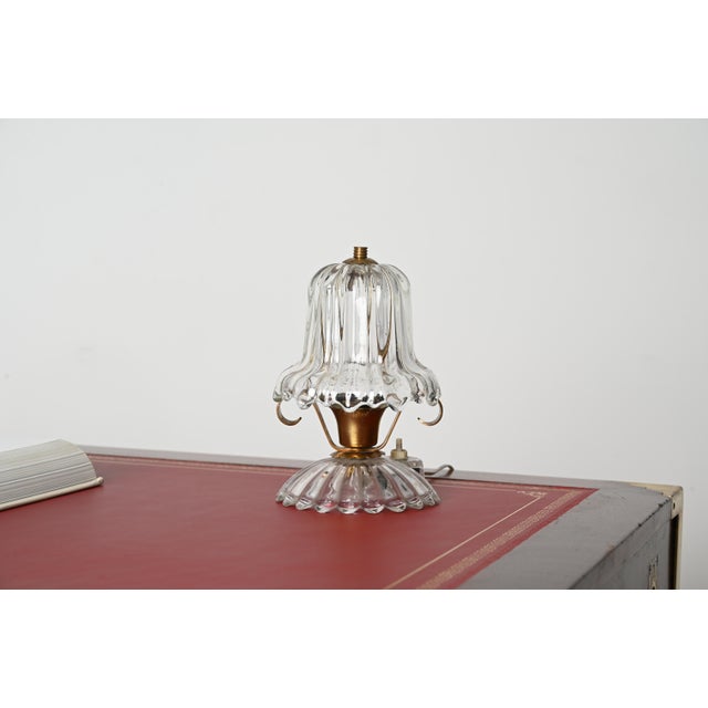 Stunning table lamp in murano mouth blown crystal glass and brass. This romantic table lamp was made in the early 40s in...