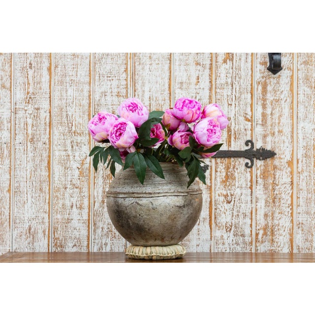 Handcrafted by Mossi tribe, these vessels are crafted in various shapes and sizes to store grains or water. Mossi pottery...